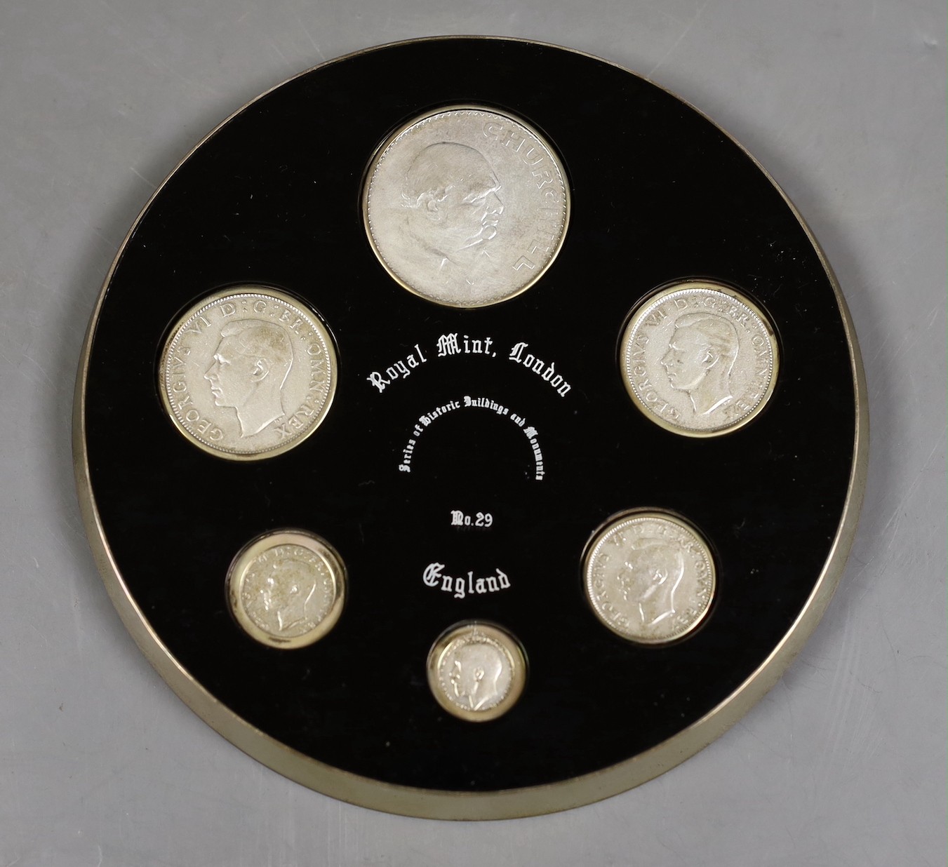 A modern silver Royal Mint coin dish, to commemorate the change over to decimalisation, inset with six coins, maker S J Rose & Son, London, 1970, 14.8cm, gross weight 10.1oz.